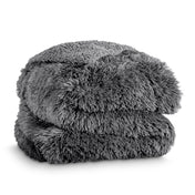 A shaggy faux fur blanket folded