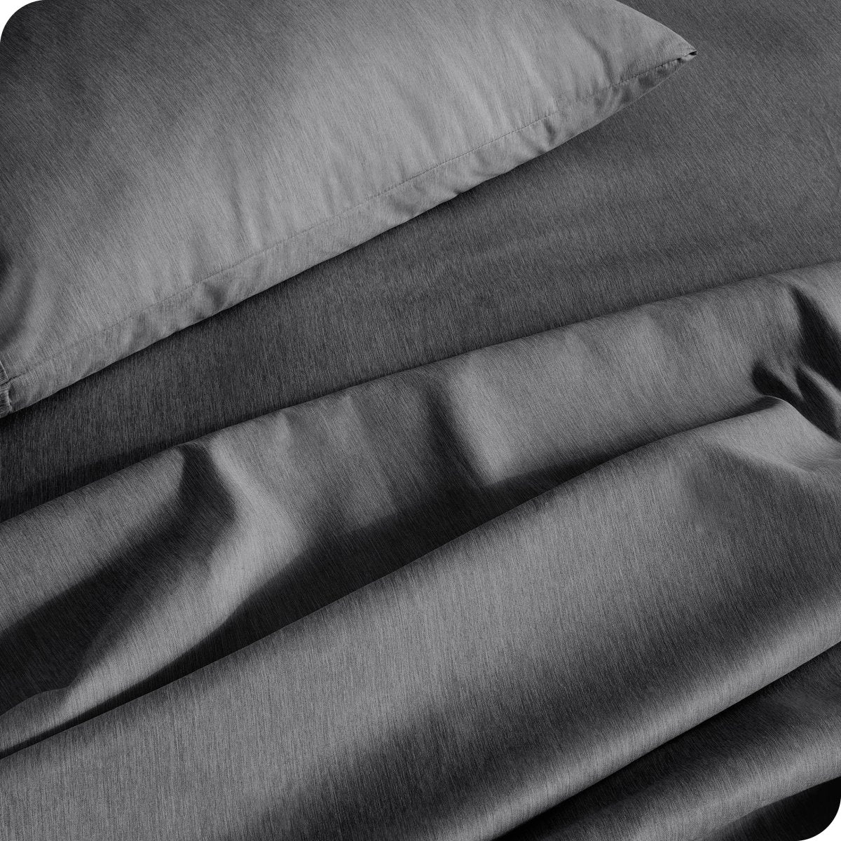 Close up of a heather sheet set on a bed