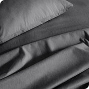 Close up of a heather sheet set on a bed
