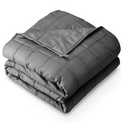 A folded cotton weighted blanket with a white background