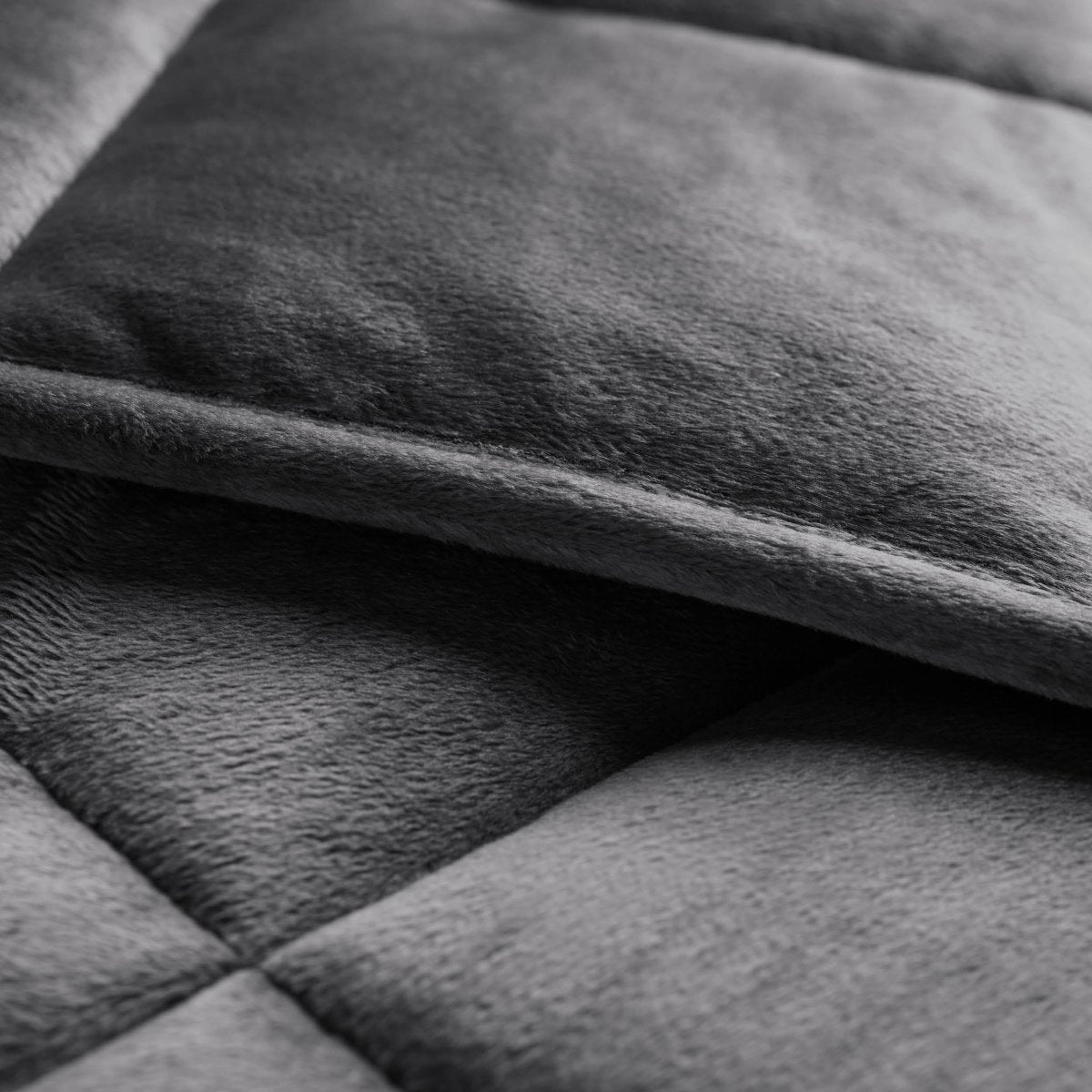 Close-up of a weighted blanket showing the stitching and texture