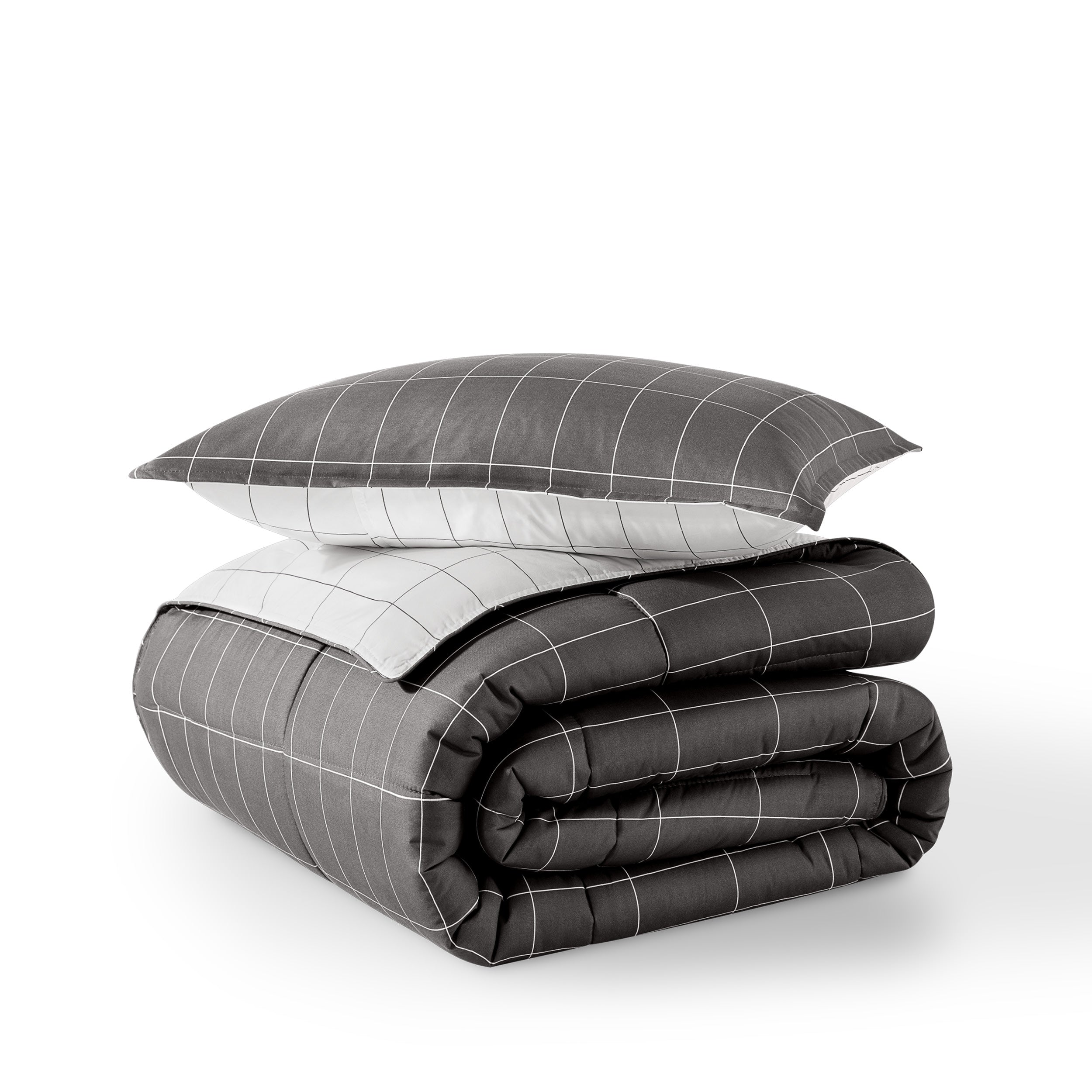 Comforter and pillow shams on a white background