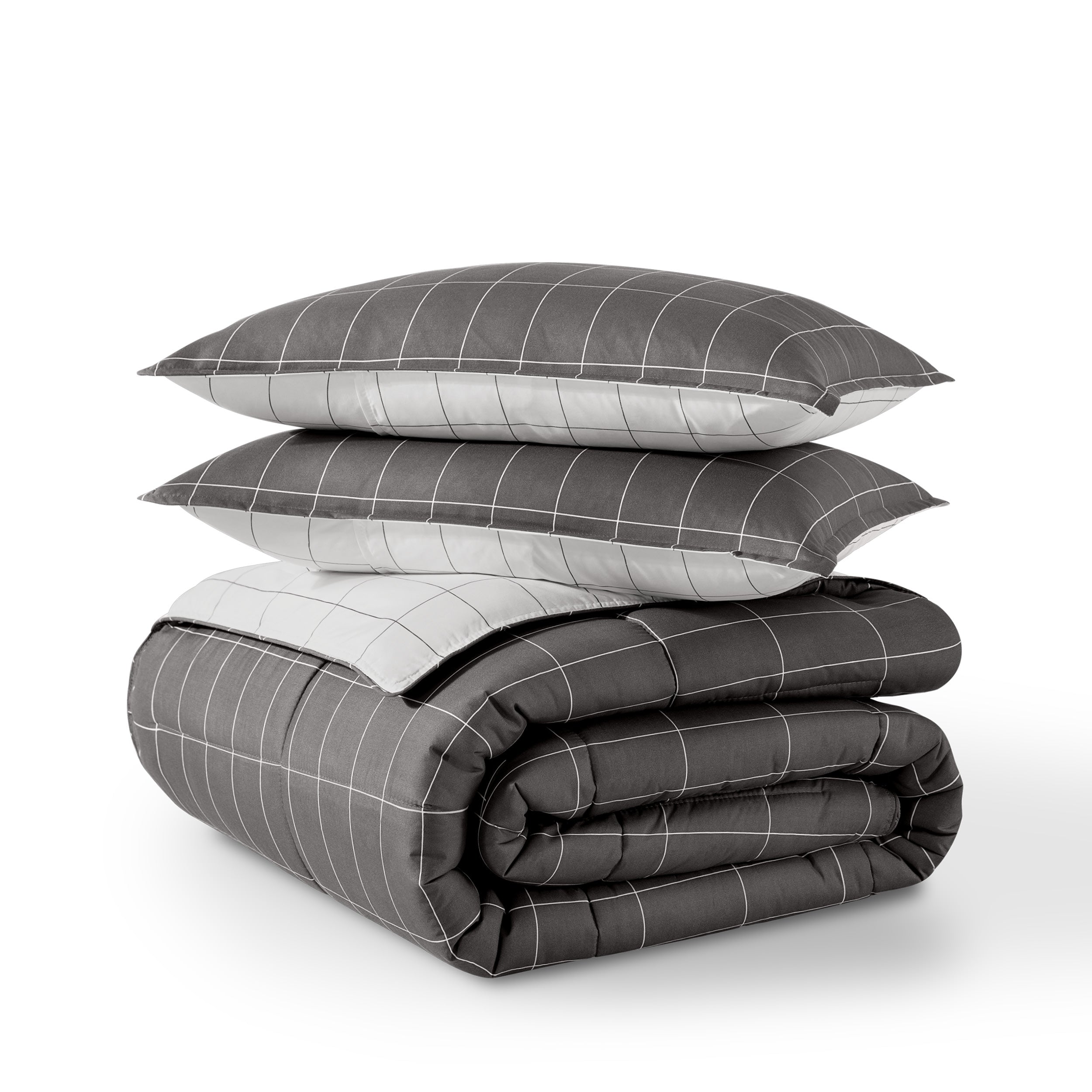 Comforter and pillow shams on a white background