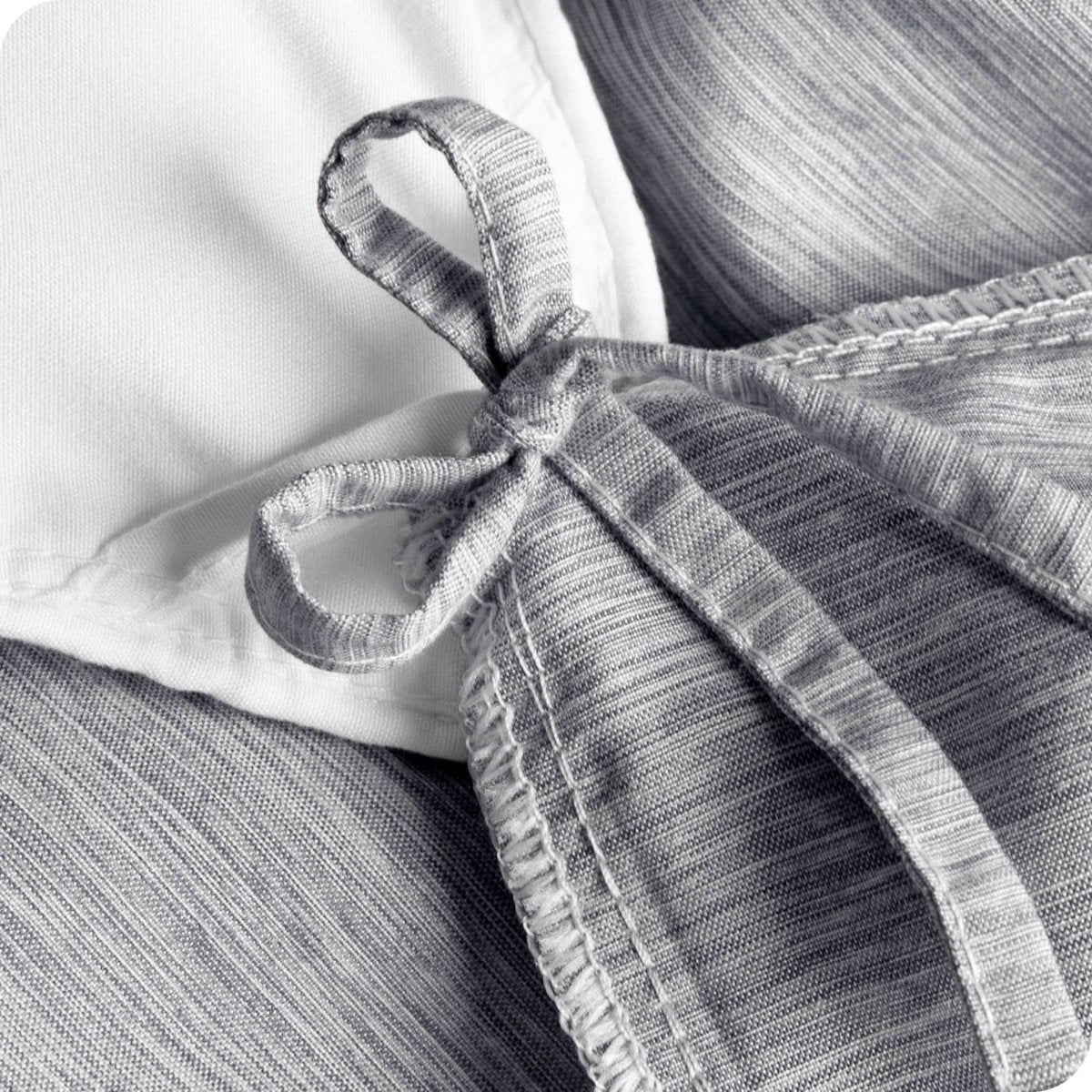 Close up of the cloth tie straps used to secure the duvet cover to the insert