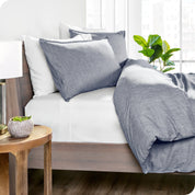 Side view of a bed with a microfiber duvet cover set on it