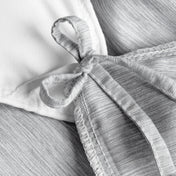 Close-up of a a corner tie detail on a duvet cover