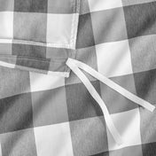 Close-up of a checkered duvet cover with corner ties