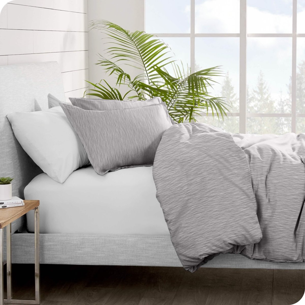 Side view of a bed made with a flannel duvet cover