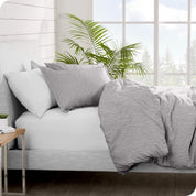 Side view of a bed made with a flannel duvet cover