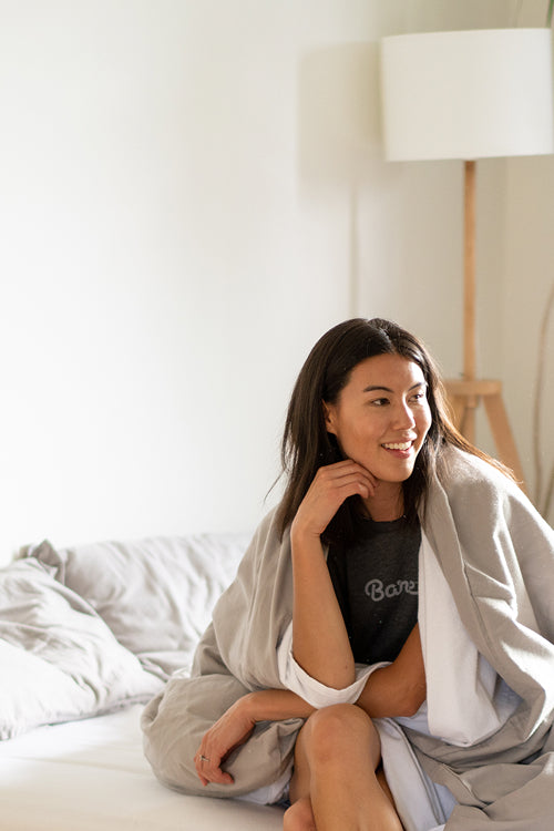 Woman in Bare Home Shirt on Bed