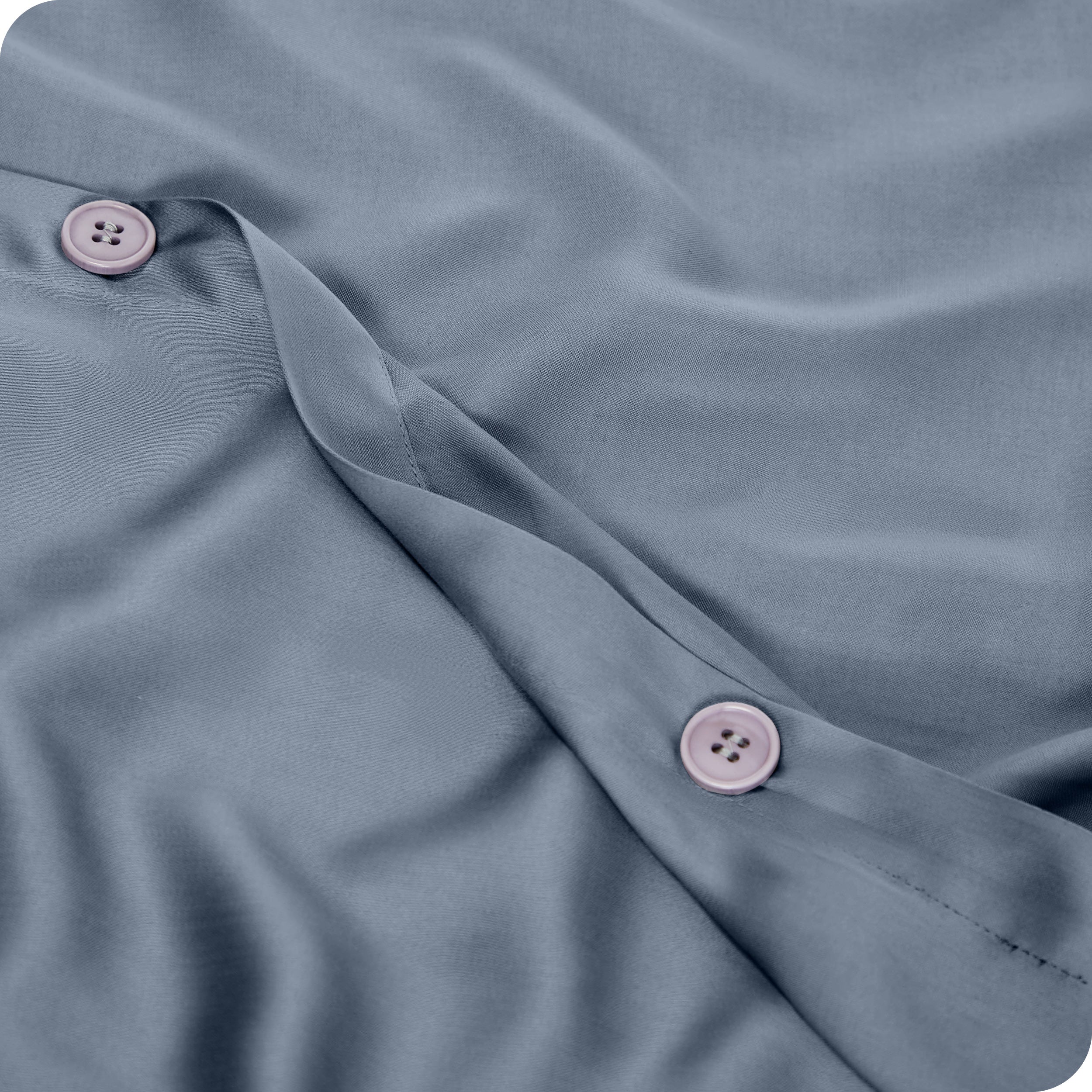 Close up of the buttons on a TENCEL™ duvet cover