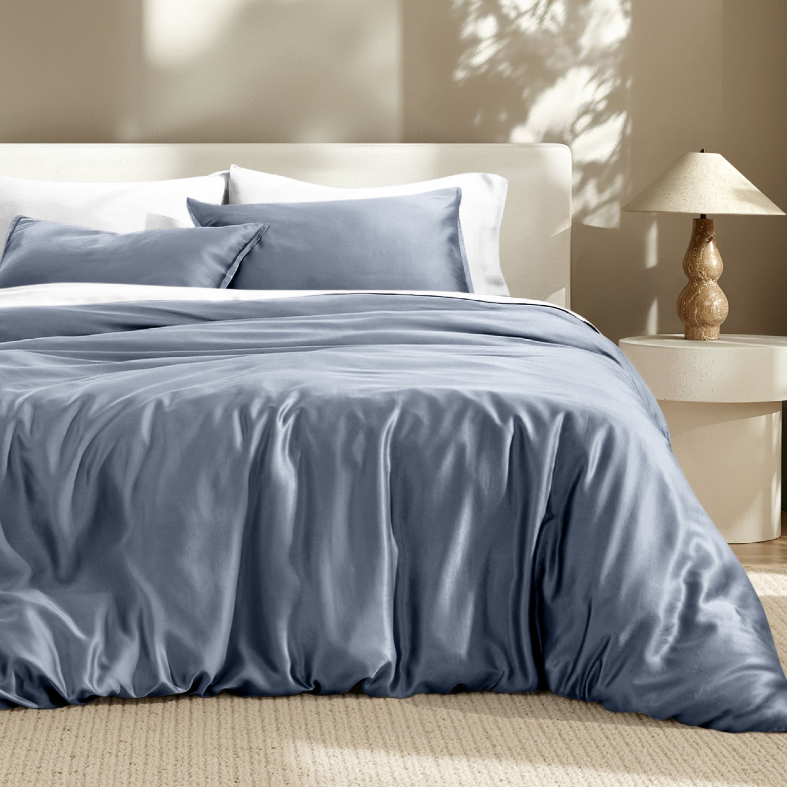 Bedding set on a bed with a lamp in the background