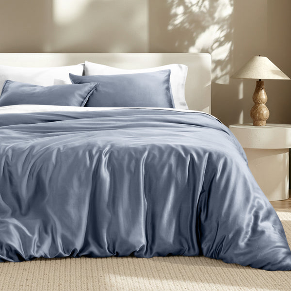 Bedding set on a bed with a lamp in the background