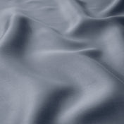 Close-up of indigo fabric with folds