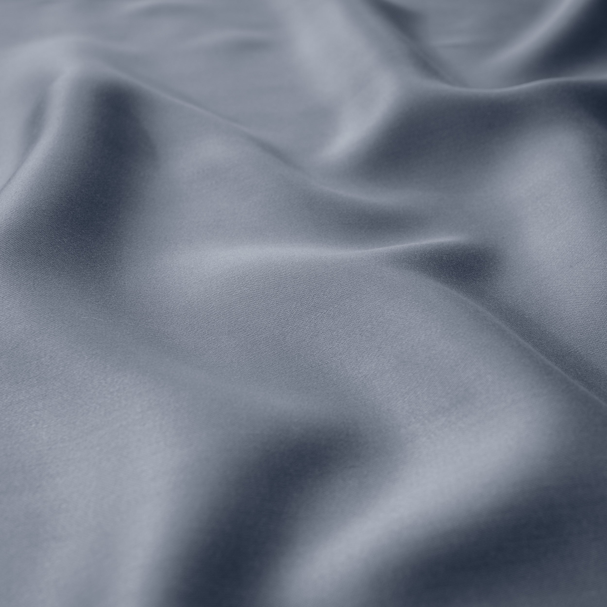 Close-up of indigo fabric with folds