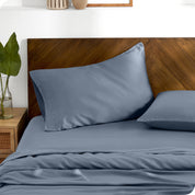 TENCEL™ pillowcases on pillows. One pillow is leaning against the headboard while the other is flat on the mattress.