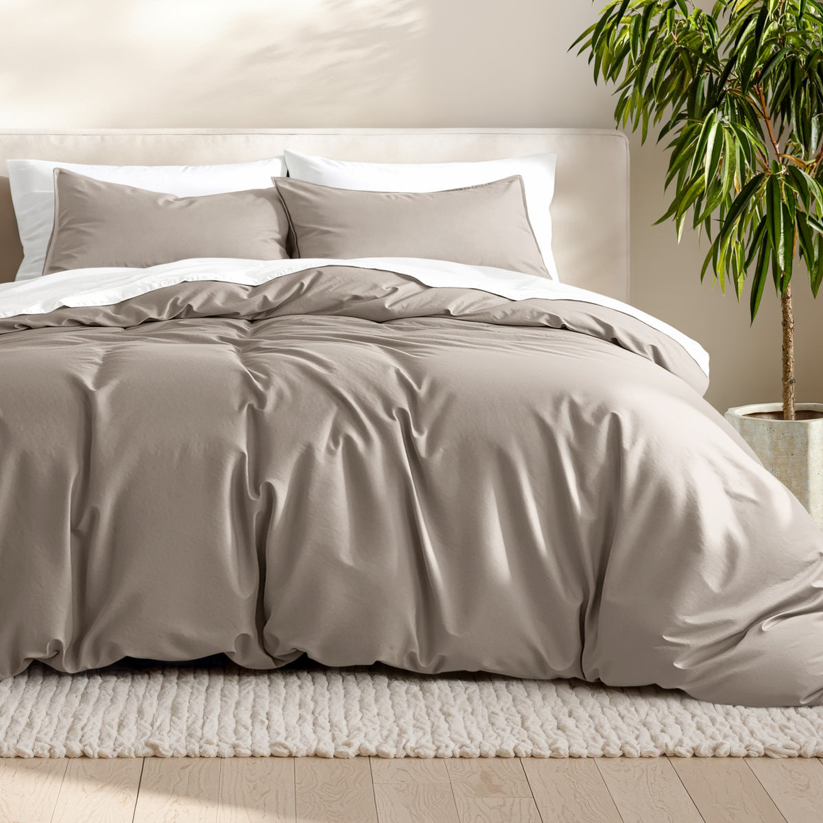 Microfiber bedding set on a bed with a neutral background