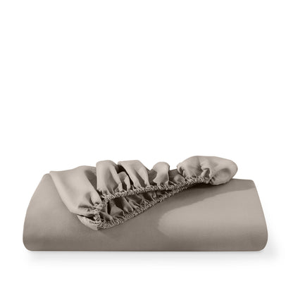 Microfiber fitted sheet folded with a white background