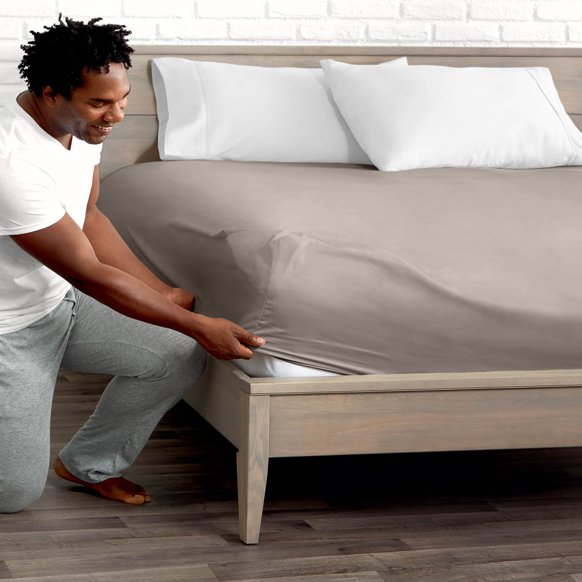 Ultra soft fitted sheet on a mattress with the sun shining into the bedroom