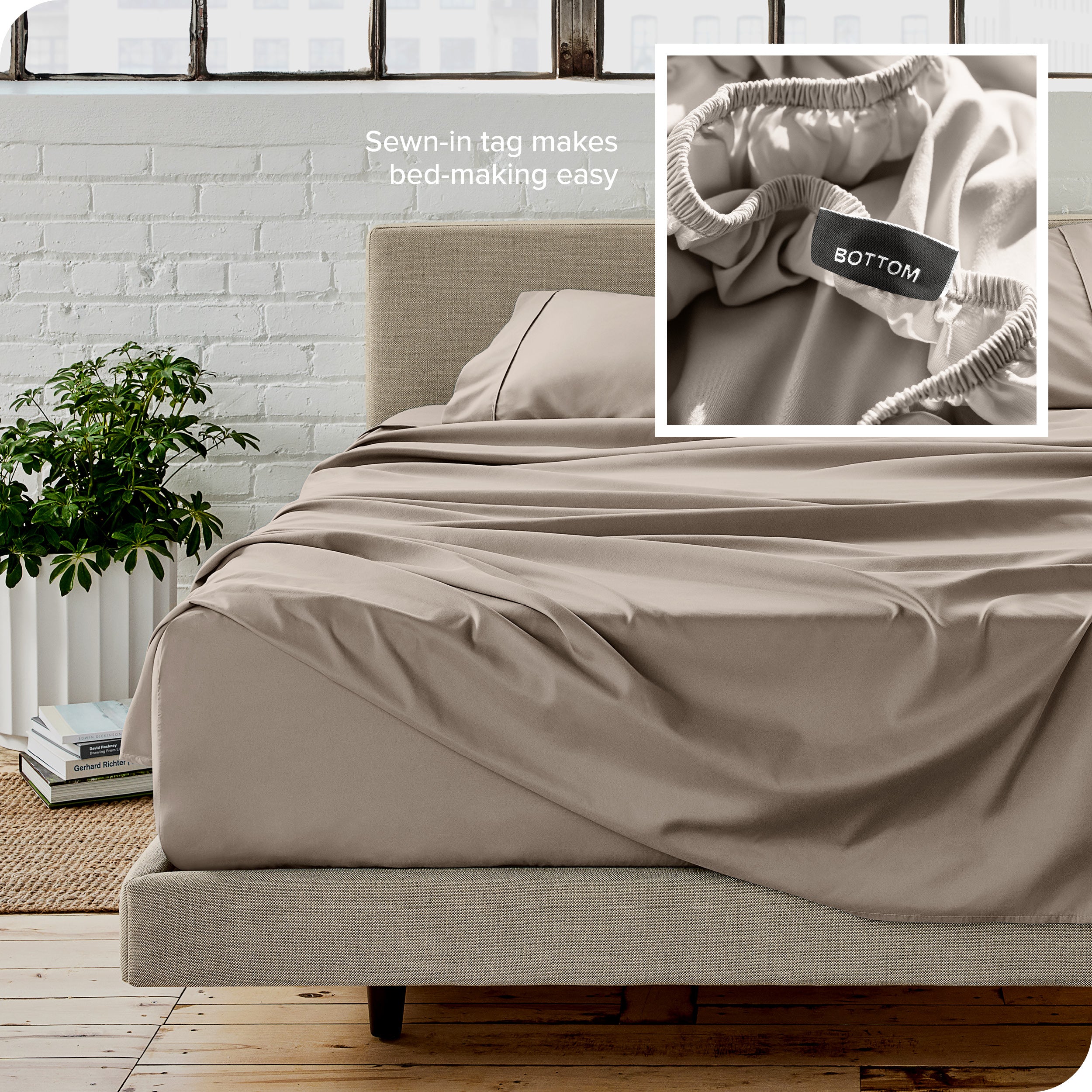 Close up of sewn in tag and matching sheets on a bed