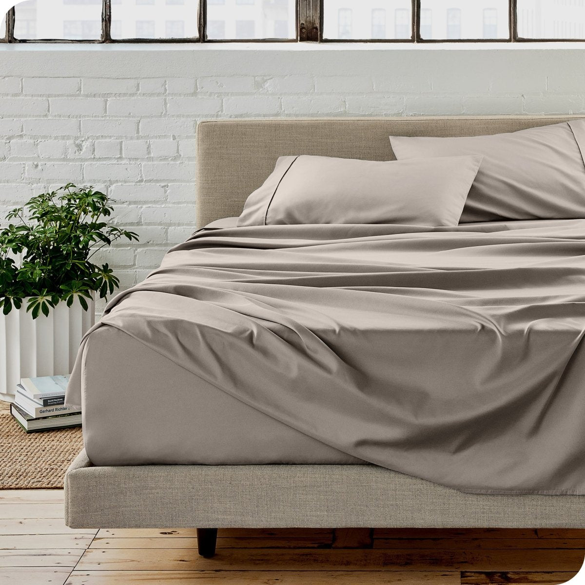 A modern bedroom with microfiber sheets on the mattress