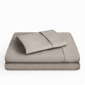 Microfiber sheet set folded and stacked neatly.