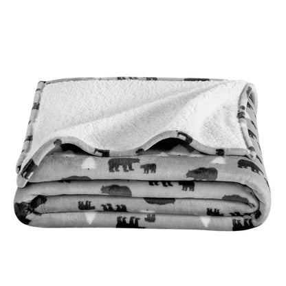 Folded blanket with bear pattern on a white background