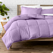 A modern bed with a down alternative comforter set on it