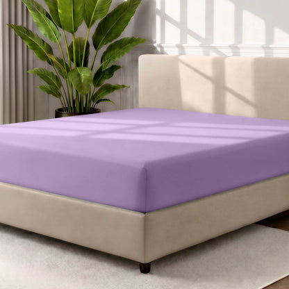 Ultra soft fitted sheet on a mattress with the sun shining into the bedroom