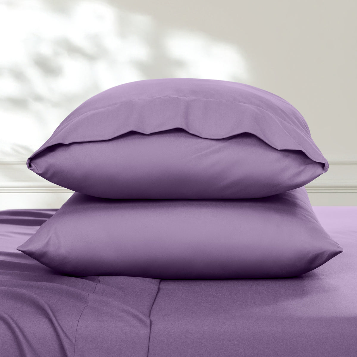 2 pillowcases on pillows