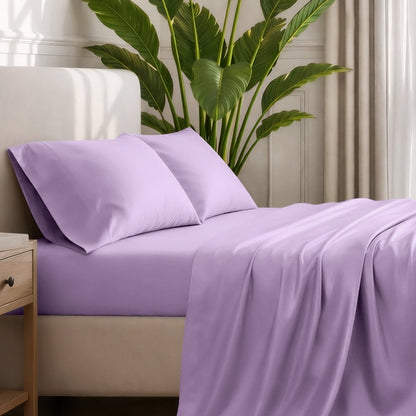 Ultra-soft sheets and pillowcases on a bed with a plant in the background