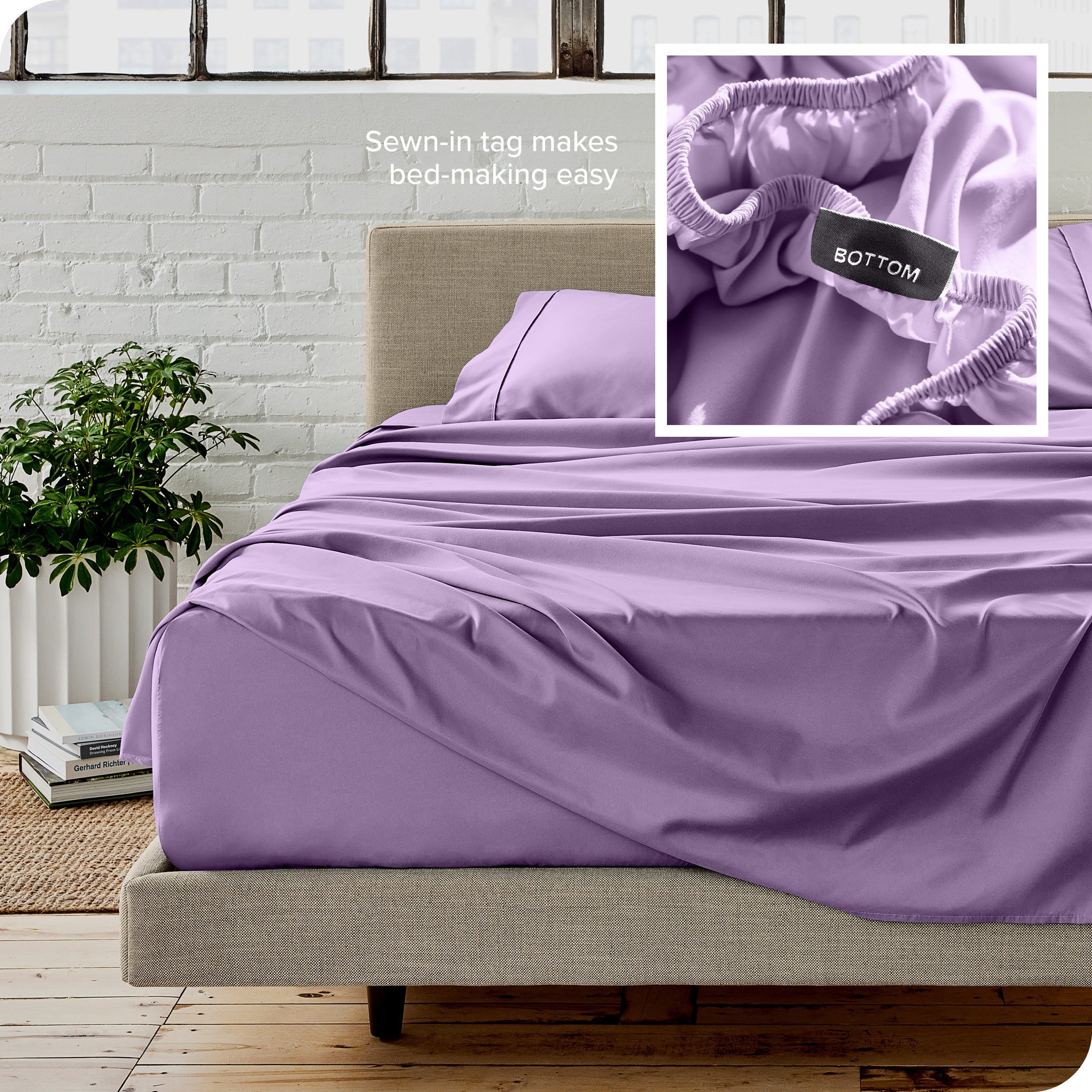 Close up of sewn in tag and matching sheets on a bed