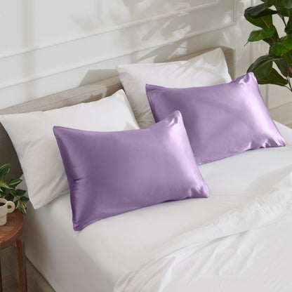 Satin pillowcases on a bed with white bedding