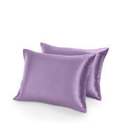 Two satin pillowcases on a white background