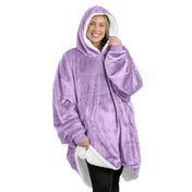 An adult with a sherpa wearable blanket on