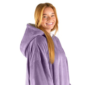 An adult with a hooded wearable blanket on