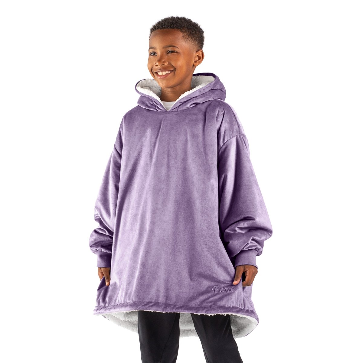 A child with a sherpa wearable blanket on
