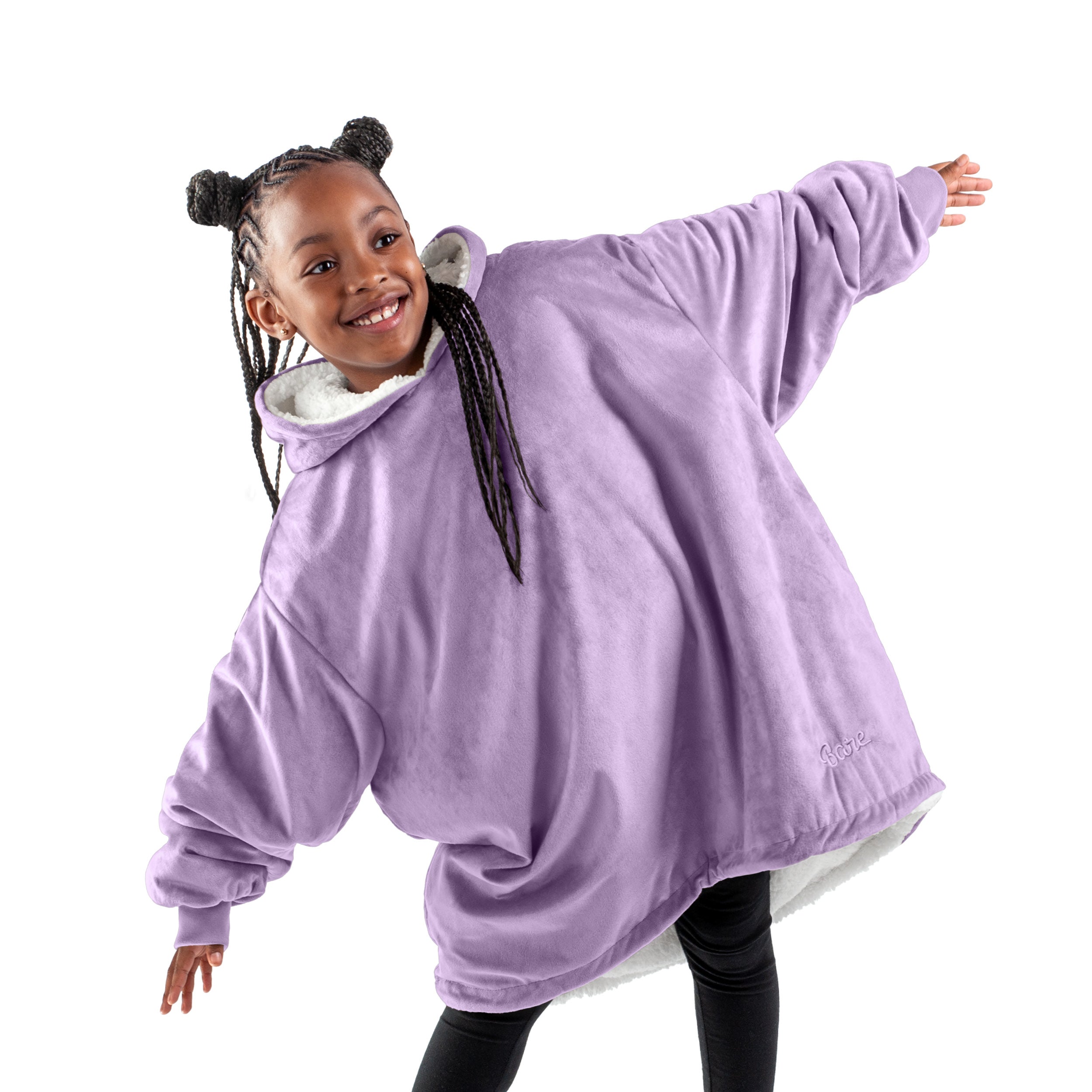 A child with a sherpa wearable blanket on