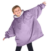A child with a wearable blanket on