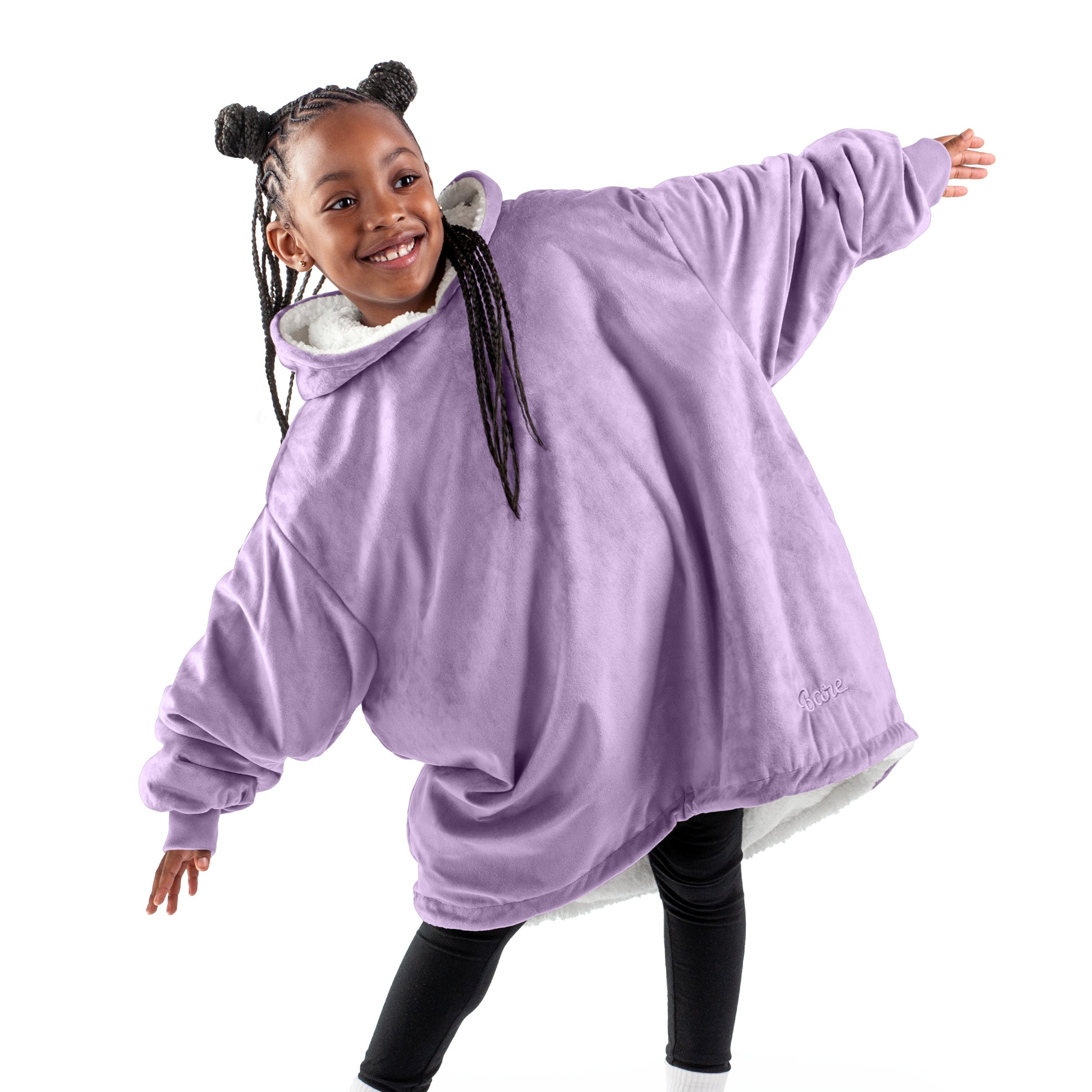 A child with a wearable blanket on