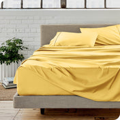 A modern bedroom with microfiber sheets on the mattress
