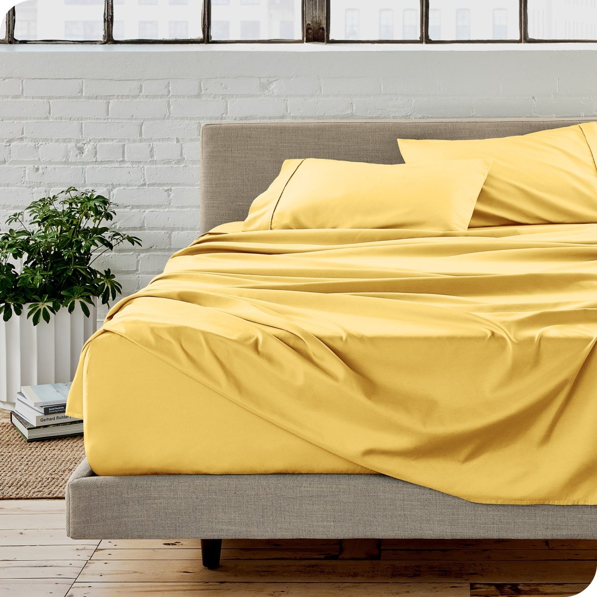 A modern bedroom with microfiber sheets on the mattress