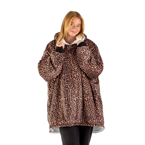An adult with a sherpa wearable blanket on