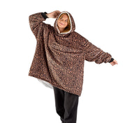 An adult with a sherpa wearable blanket on