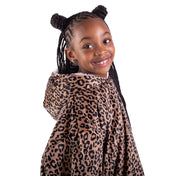 A child with a sherpa wearable blanket on