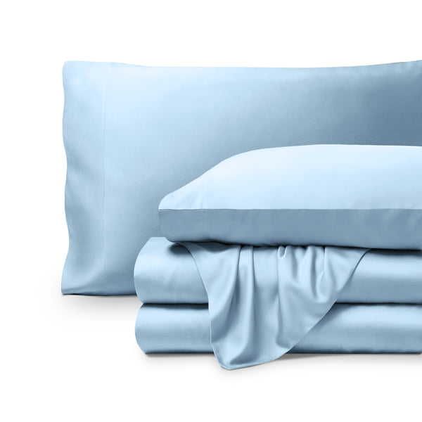 Bamboo pillowcases and sheets set on a white background