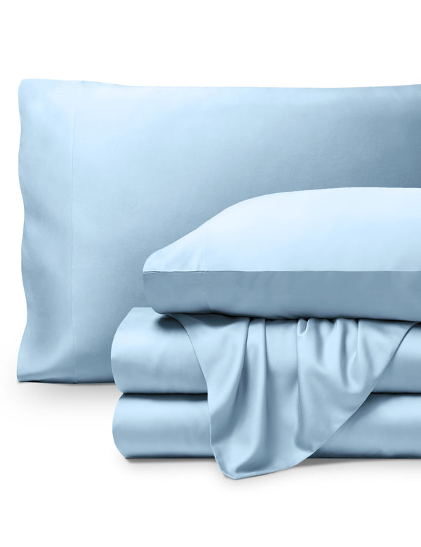 Bamboo pillowcases and sheets set on a white background