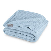 A cotton waffle blanket folded