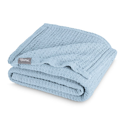 Folded blanket with a Bare Home label on a white background