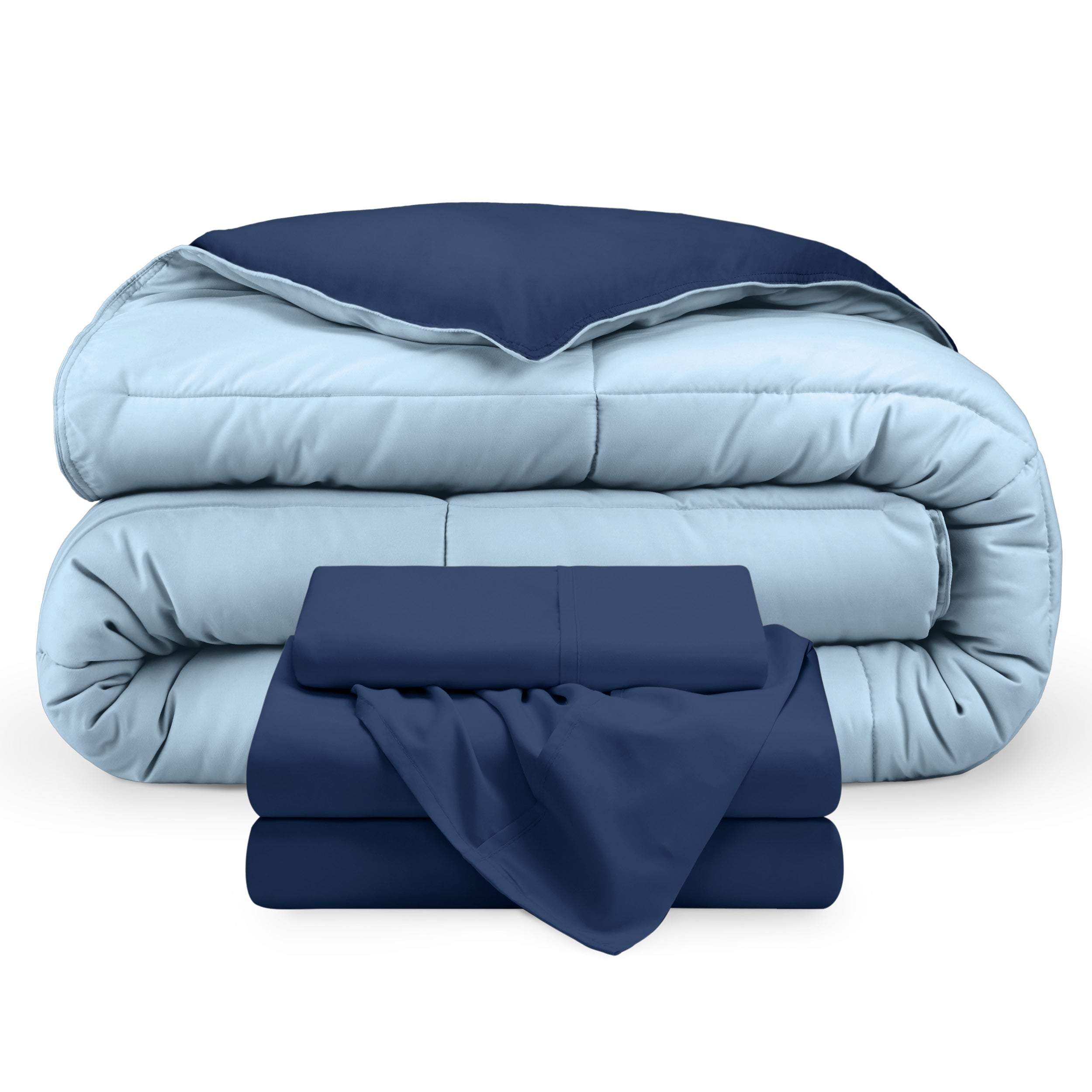 A reversible microfiber comforter and a coordinating sheet set folded and stacked 